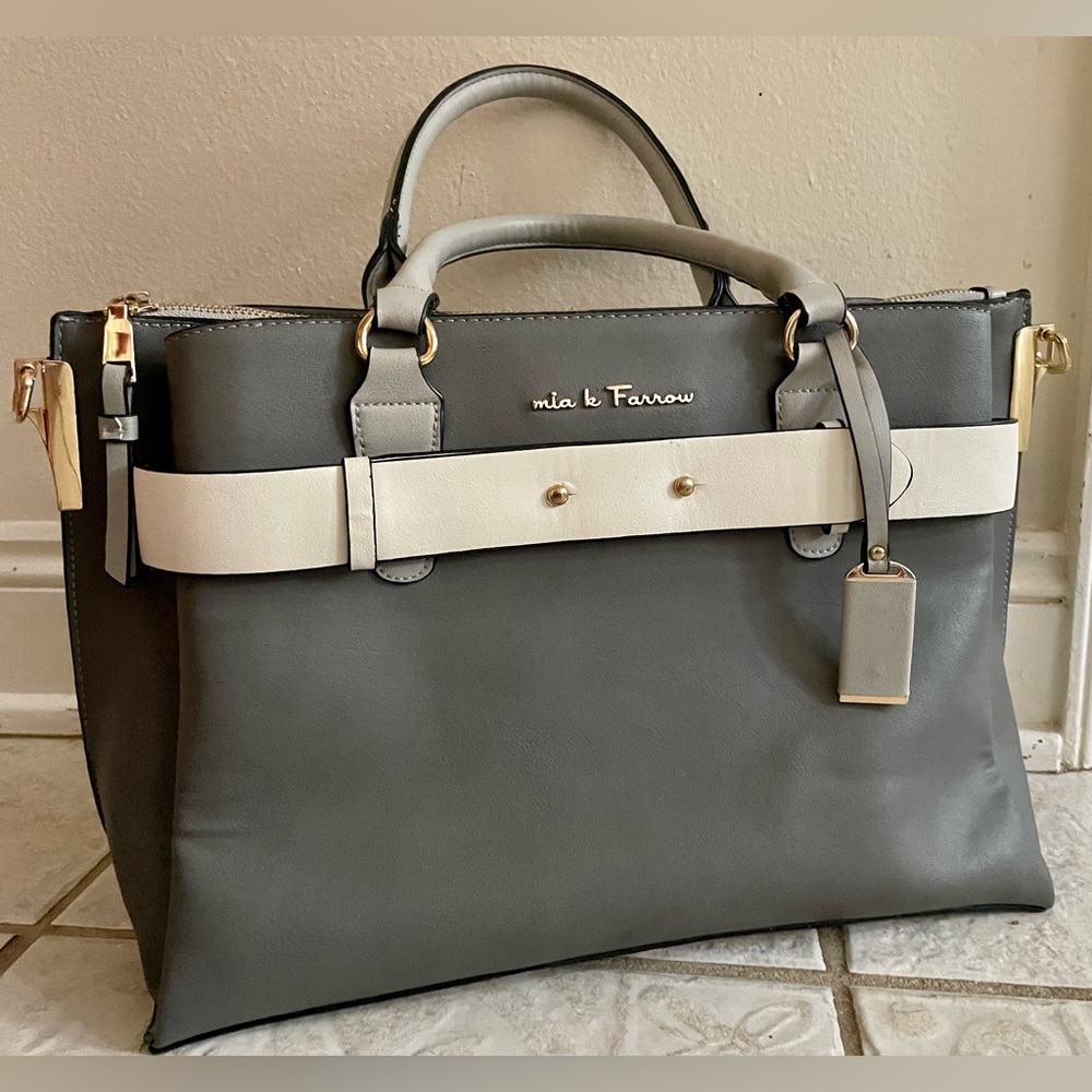 Grey handbag, in the style of mia k Farrow